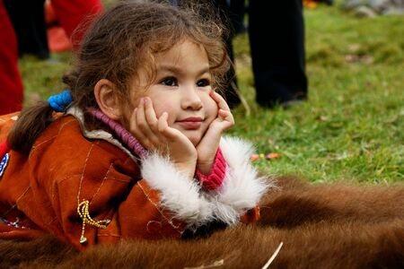 pensive child in its own daydreamの写真素材