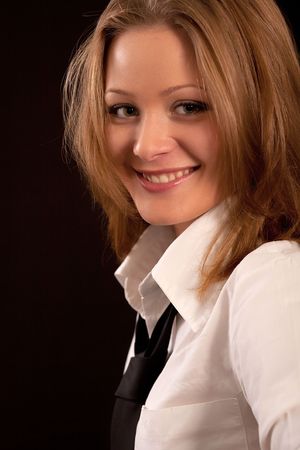Portrait of the charming girl on a black backgroundの写真素材