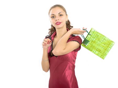 The girl in a red dress with a gift in handsの写真素材