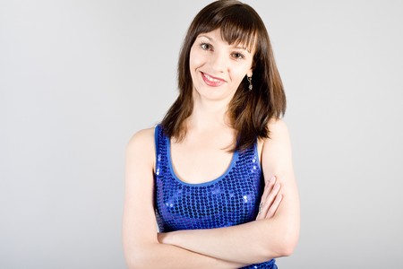 The beautiful girl in a elegant dress on a grey backgroundの写真素材