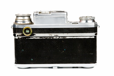 Old film camera on a white background. Isolated