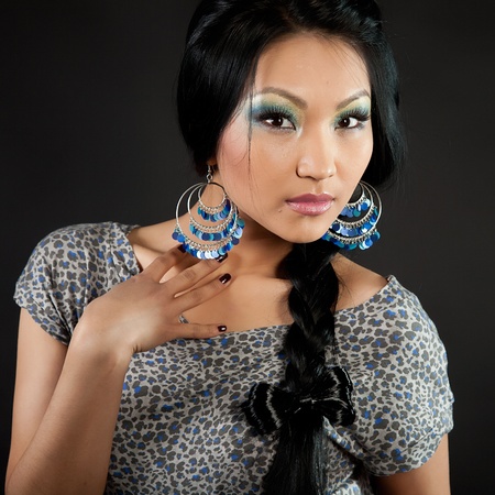 Portrait of the attractive brunette on a black backgroundの写真素材