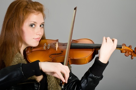 The young attractive girl with a violinの写真素材
