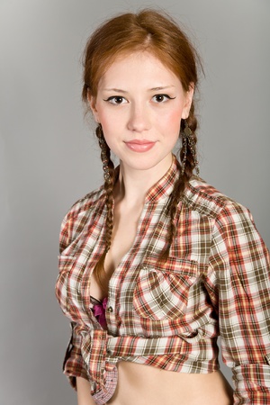 young girl in a checkered shirtの写真素材