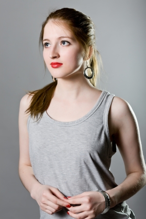 Portrait of a young girl in a gray blouseの写真素材