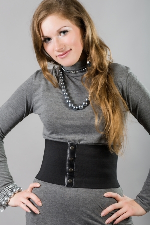 portrait of brunette in a gray  dressの写真素材