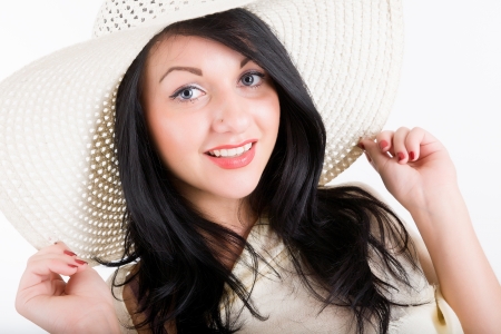 attractive young woman in a beach hatの写真素材