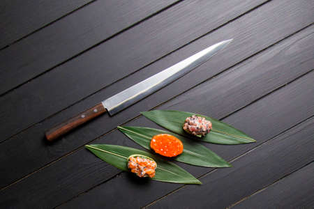 Set of Gunkan Maki Sushi Rolls. Sake nigiri with salmon and tobiko roe. Gunkan with salmon caviar. ...