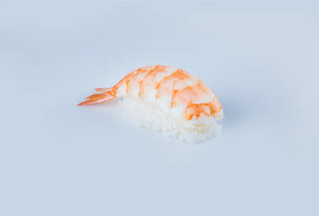 Japanese Nigiri Ebi sushi with black tiger shrimp and rice, isolation on gray background. Japanese cuisine. Pan Asian menu dish isolated. Restaurant menu. Copy space. Background image.の写真素材