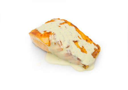 Steamed salmon steak with white sauce isolated on white background. Fish fillet isolation for restaurant menu.の写真素材