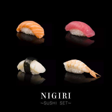 Set of Japanese Nigiri sushi different pieces with salmon, tuna, white fish, shrimp (prawn) isolated on black background. Advertising menu banner with text space. Seafood varietyの写真素材