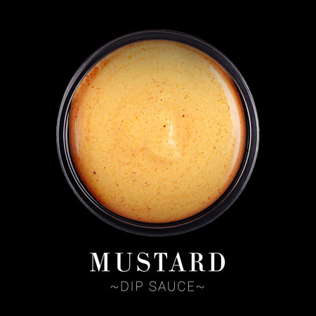 Mustard dip sauce served in plastic delivery container box isolated on black background. Ready menu advertising banner with text and copy spaceの写真素材