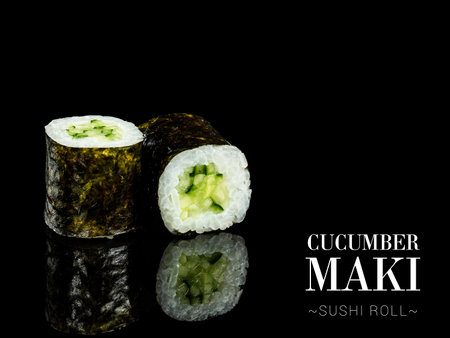 Side view of Maki sushi roll pieces with mirror reflection on black background. Sushi roll with cucumber and nori seaweed on top. Ready menu advertising banner with text and copy space.の写真素材