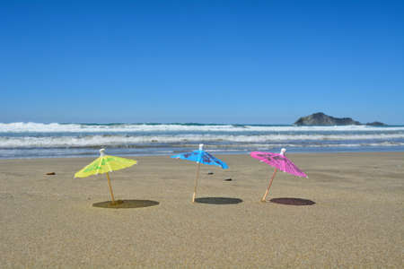 3 Party umbrellas on the beach.の写真素材