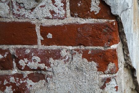 Old dirty brick wall texture. House in provincial town. Close up.の写真素材