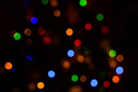 Christmas Background with defocused lights of a fir treeの写真素材