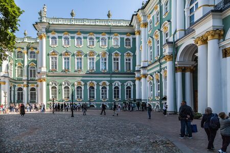 Saint Petersburg, Russia, August, 8, 2017 - Winter Palace. Hermitage. Courtyard. People walking, others stay in line for tickets to museum.のeditorial素材