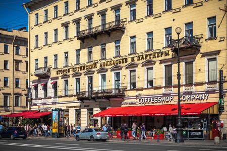 Saint Petersburg, Russia, August, 8, 2017 - Houses of the German Lutheran church of Saint Peter. Nevsky prospect, 24. People walking down the street.のeditorial素材