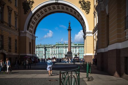 Saint Petersburg, Russia, August, 8, 2017 - View of the Palace Square, Winter Palace and Alexander Column from the arch.  People are walking.のeditorial素材