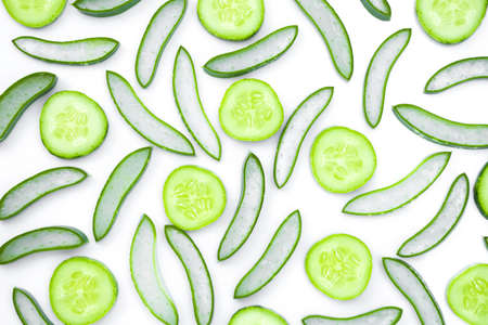 Closeup fresh organic aloe vera and cucumber slice pattern texture for background. Herbal medical plant concept. Top view. Flat lay.の写真素材