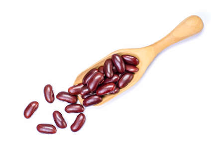 Closeup red beans or kidney bean in wooden scoop isolated on white background. Top view. Flat lay.の写真素材