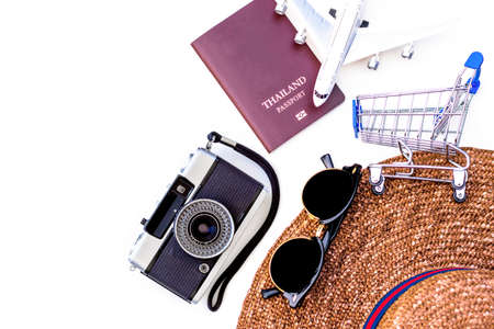 Mock up trip accessories, passport and plane model isolated on white background. Summer and holiday travel concept.の写真素材