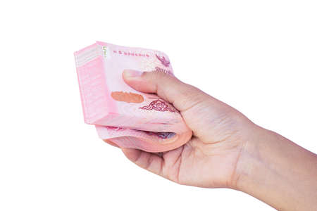 Closeup man hand holding money banknotes isolated on white background with clipping path. Hand...