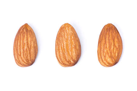Closeup almond nuts isolated on white background. Top view. Flat lay.の写真素材