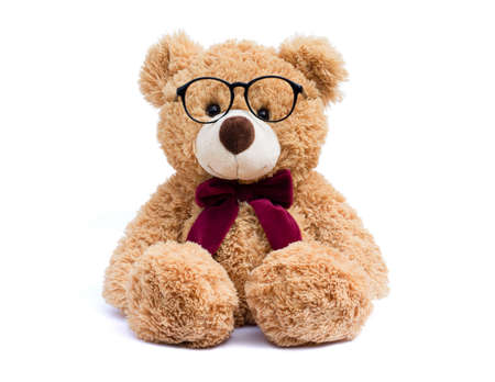 Brown teddy bear with eye glasses  isolated on white background.の写真素材