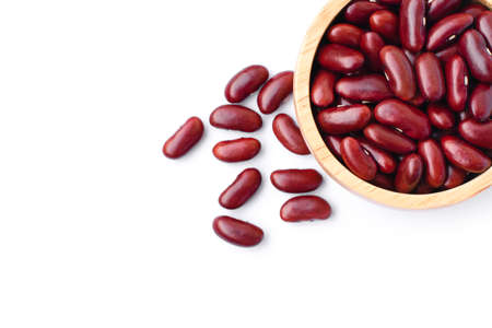 Closeup red beans or kidney bean in wooden bowl isolated on white background. Overhead view. Flat...