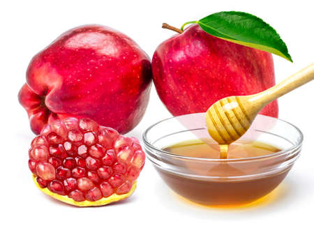 Pomegranate and red apple with honey isolated on white background.の写真素材