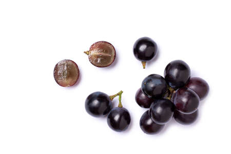 Bunch of dark blue grape isolated on white background, top view, flat lay.の写真素材
