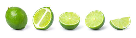 Set of whole and half slice of green lime fruit isolated on white background.の写真素材