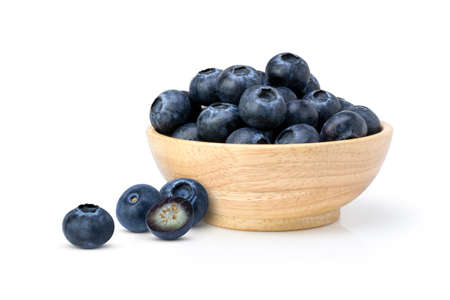 Blueberries fruit in wooden bowl  isolated on white background.の写真素材