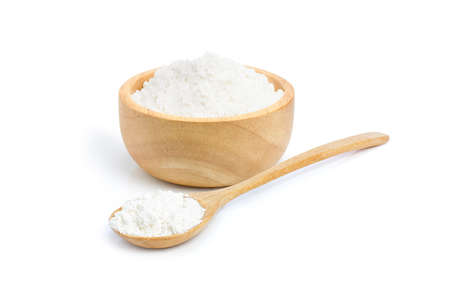 Sea salt in a wooden bowl and spoon isolated on white background.