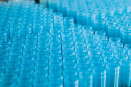 rack of blue plastic pipette nozzles made of polypropyleneの写真素材
