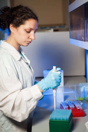 Female researcher making preparation of biological samplesの写真素材