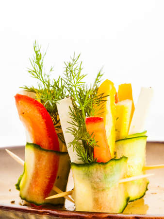 Fresh vegetable rolls with feta cheese, tomatoes, paprika, carrots, cucumber, celery and dillの写真素材