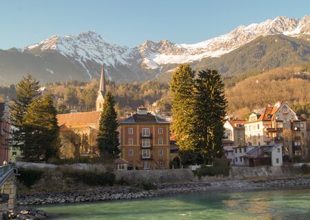 urban views near the river on a background of high mountainsの写真素材