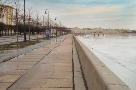 embankment of the river covered with massive granite slabsの写真素材