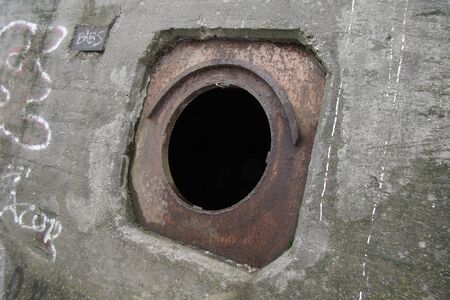 open rusty box on a concrete wallの写真素材