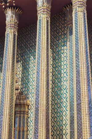 three high richly inlaid with gold columns