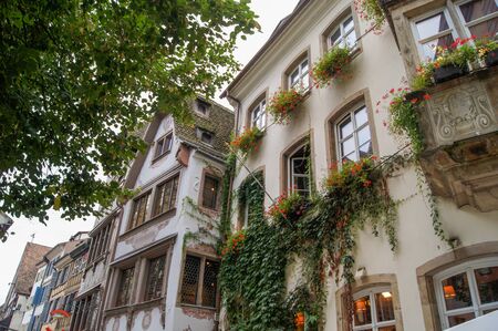 facade of the old house decorated with flowersの写真素材