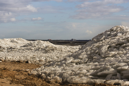 high pile of crushed ice on the shoreの写真素材
