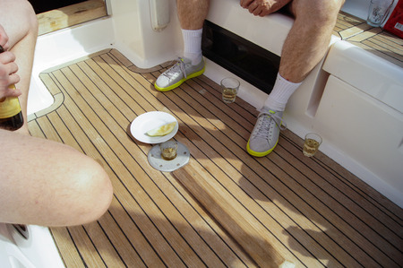 Rest on the deck of a yacht with wine