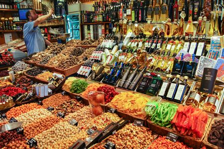 Barcelona market, Spain - August 1, 2015.Store nuts, dried fruit and vegetable oil.のeditorial素材