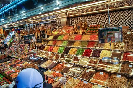 Barcelona market, Spain - August 1, 2015.Pavilion with nuts and dried fruits bottle of oil.のeditorial素材