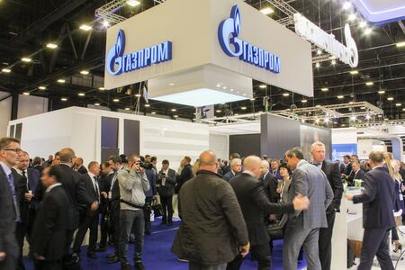 St. Petersburg, Russia - 6 October, 2015.Expo forum. International Gas Forum. Photographer working among the crowd of people on the Gas Forum.のeditorial素材