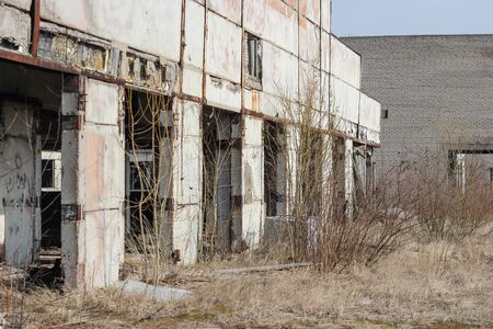 Dilapidated housing barnyard. Old abandoned industrial and agricultural facilities destroyed.