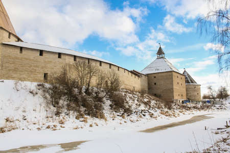 The city walls on the shore. Staraya Ladoga, Russia - 23 February, 2016. Tourist places in the great ancient route from the Vikings to the Greeks.Staraya Ladoga fortress. Gold ring of Russia.のeditorial素材